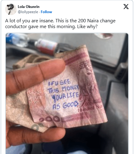 Close-up of handwritten message on ₦200 banknote