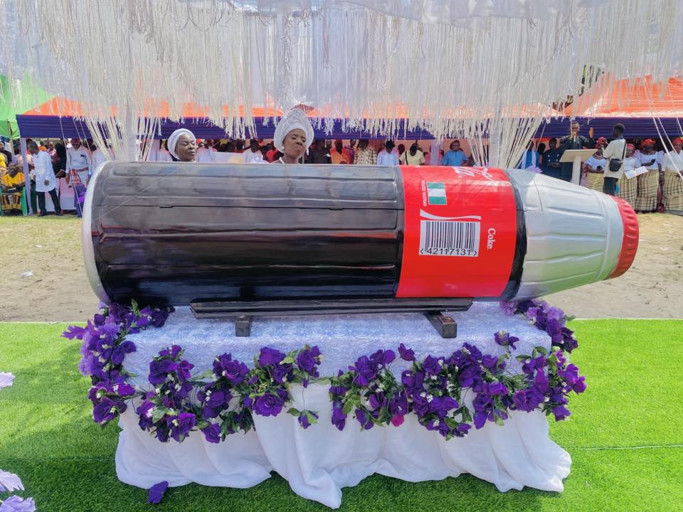 Family members with the Coca-Cola casket