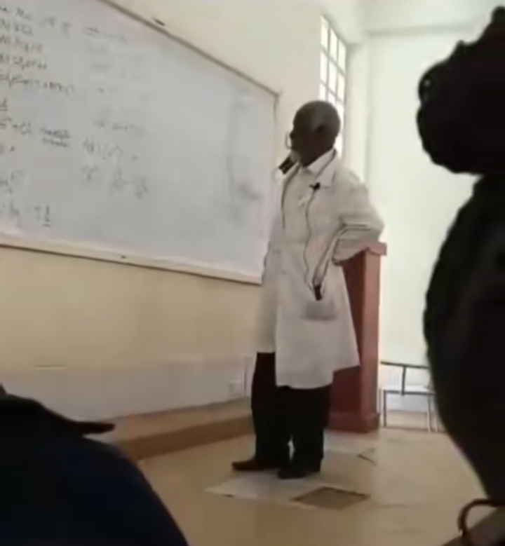 Lecturer struggling at a whiteboard
