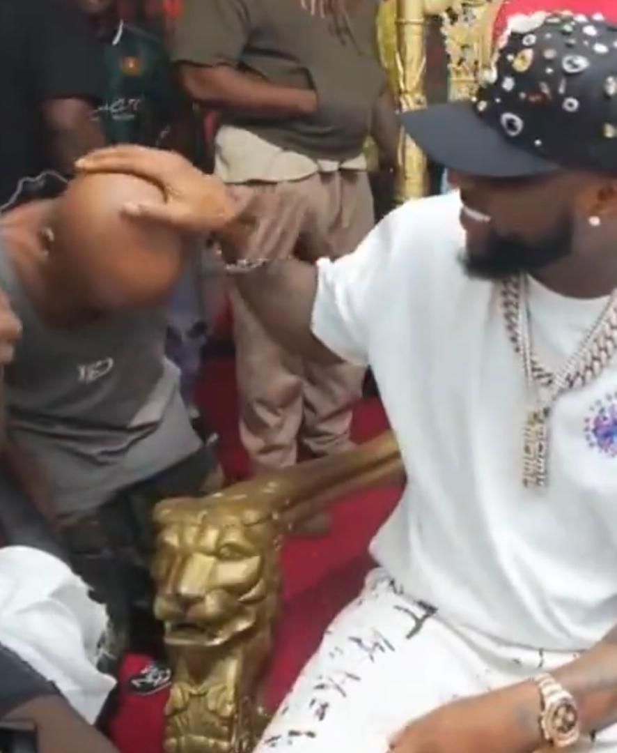 Kolu with Davido's hand tattoo on his head